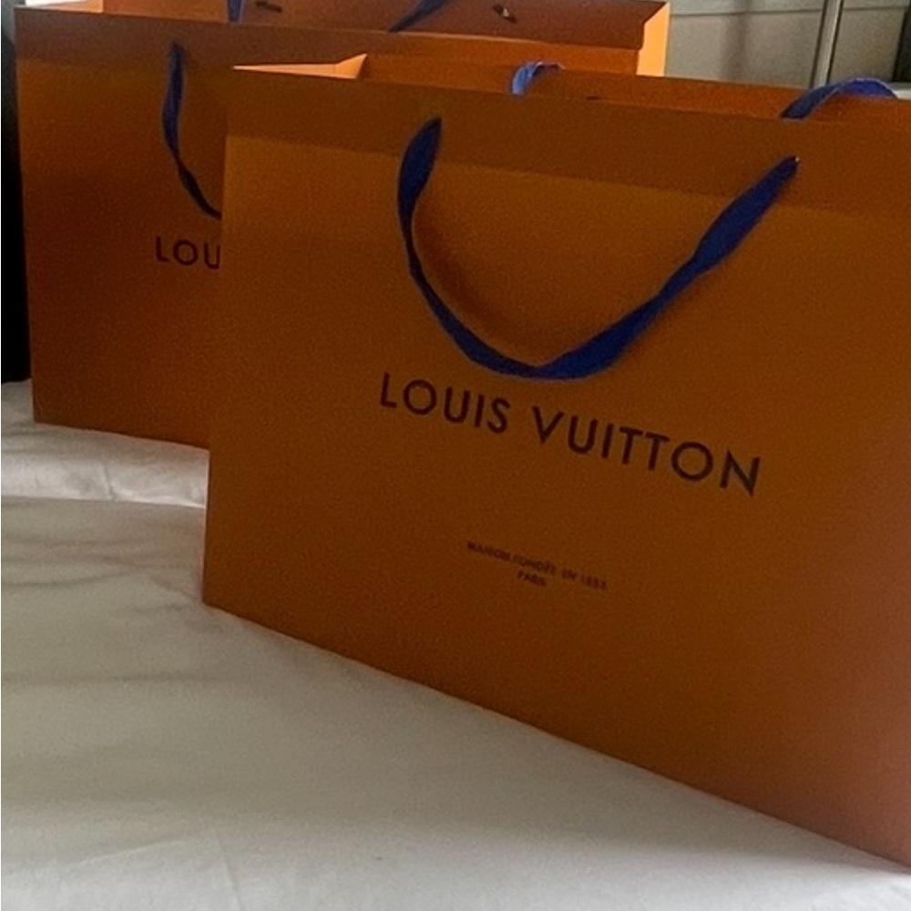 Two Bold Orange shopping Bags 🛍️ with Blue lettering and Handles